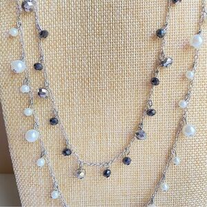 Long two strand necklace with dangling black gray crystals and white faux pearls